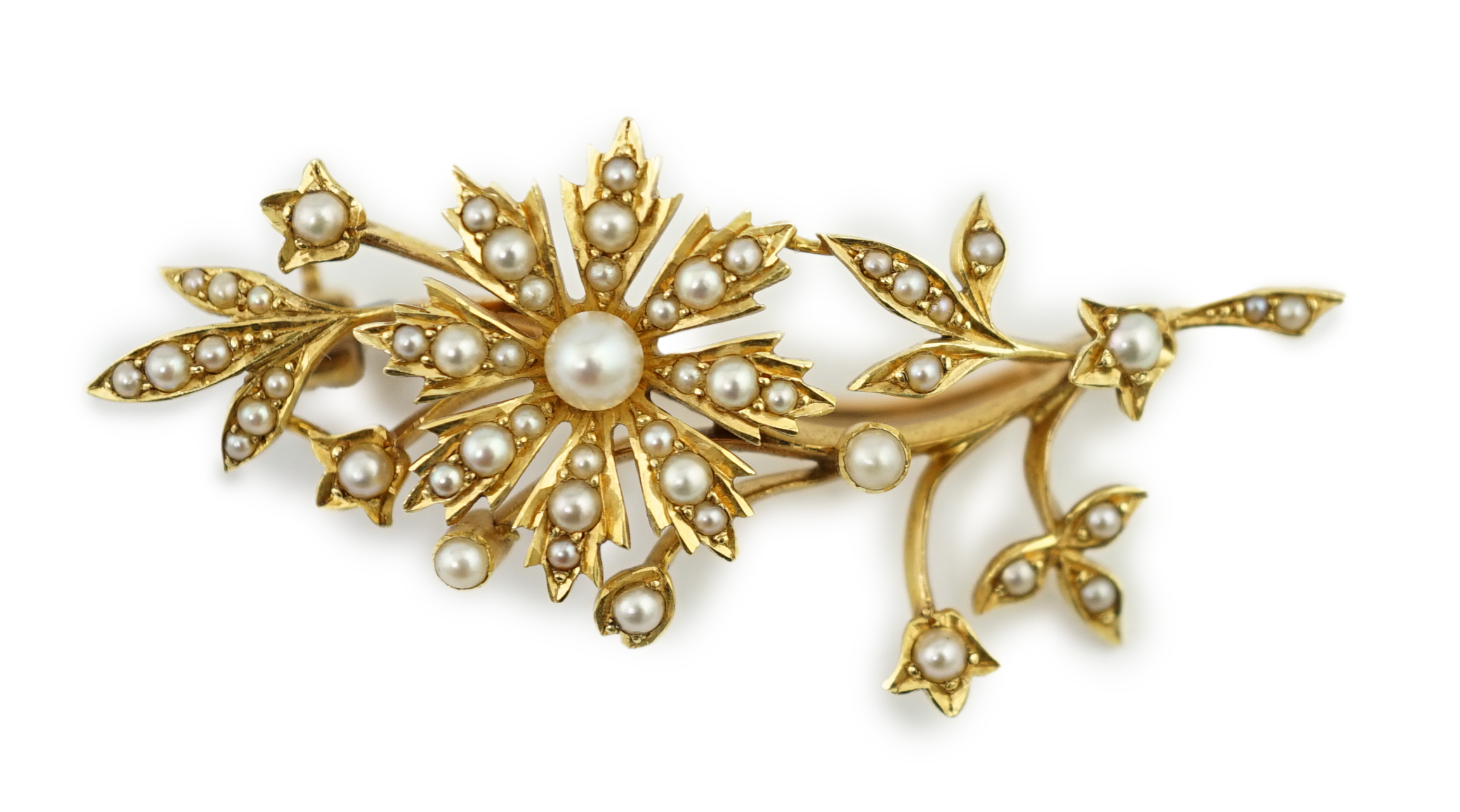 An Edwardian gold and graduated seed pearl set foliate brooch